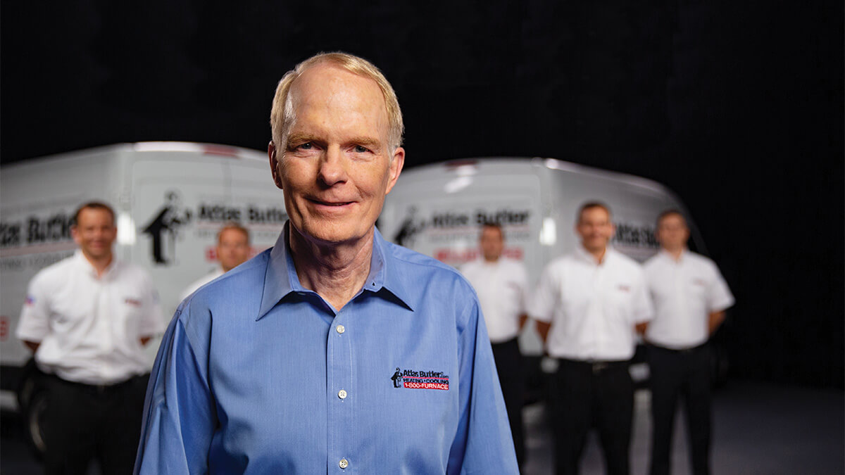 Mark Swepston, third generational owner of Atlas Butler Heating, Cooling, and Plumbing, pictured with a team of HVAC technicians.