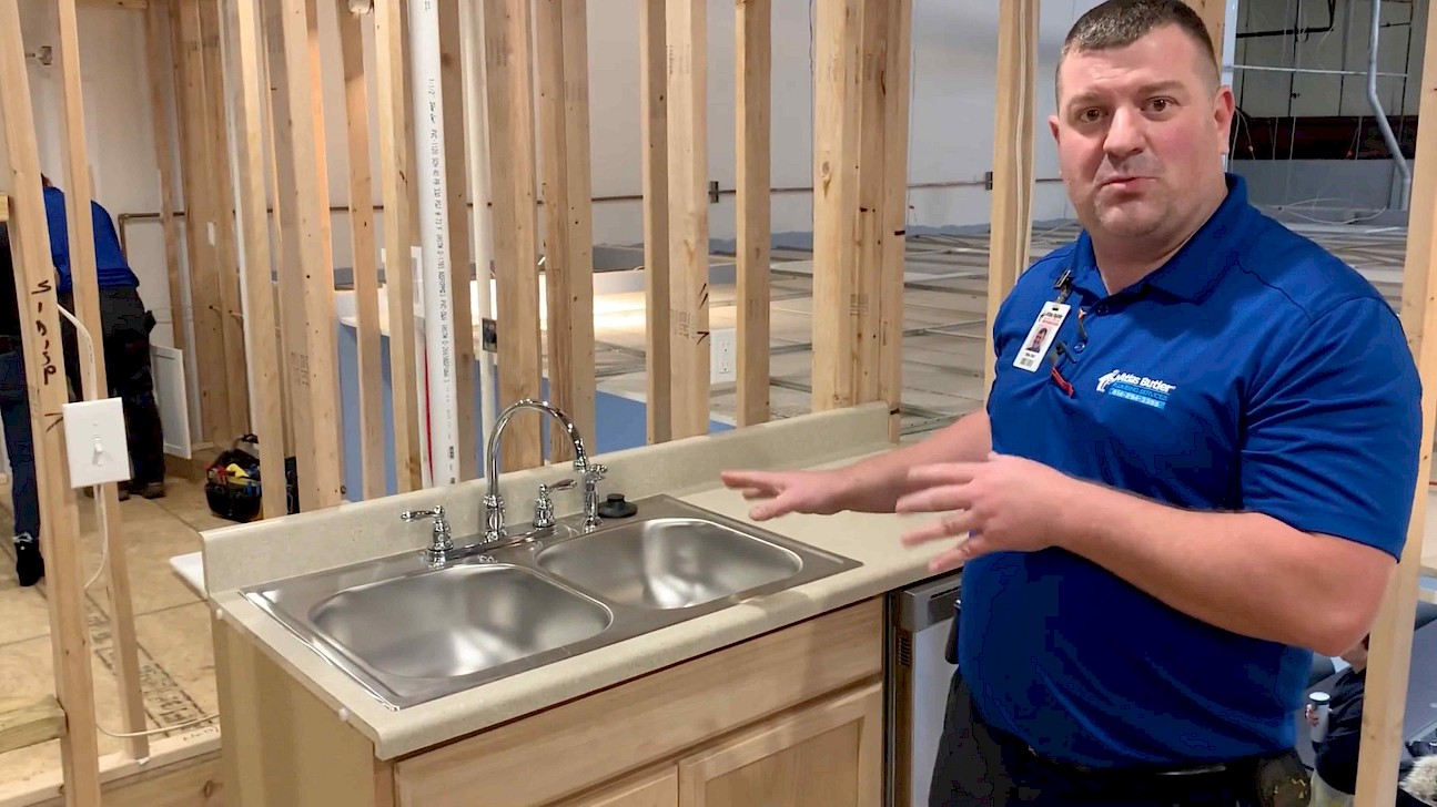 Atlas Butler Plumber at the Ride to Decide training center in Columbus Ohio demonstrating the basics of what should and should not be put down a kitchen drain.